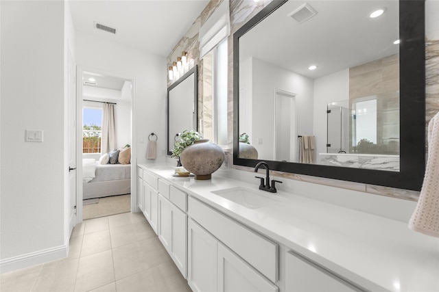2016 Morris St, Rockwall, TX 75087 - ensuite bathroom with vanity, tile patterned floors, recessed lighting, and baseboards