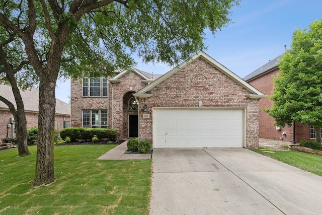 11487 Balcones Dr, Frisco, TX 75033 - traditional-style house featuring a garage, driveway, a front yard, and brick siding