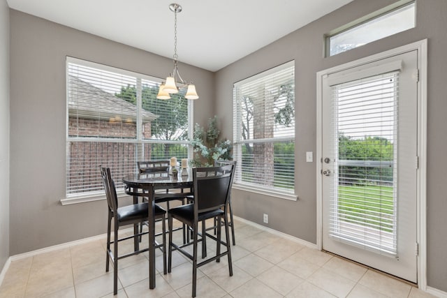 11487 Balcones Dr, Frisco, TX 75033 - dining area with plenty of natural light, a chandelier, and baseboards
