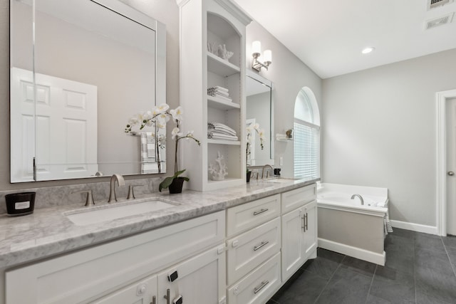 11487 Balcones Dr, Frisco, TX 75033 - bathroom with double vanity, a bath, and tile patterned floors