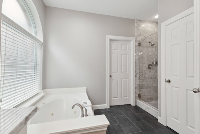 11487 Balcones Dr, Frisco, TX 75033 - bathroom featuring a stall shower, a tub with jets, and baseboards