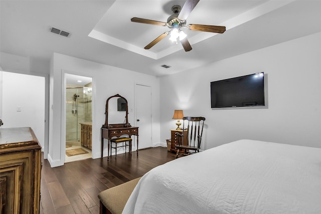674 Milam Rd, Van Alstyne, TX 75495 - bedroom with dark wood-style flooring, baseboards, a raised ceiling, ensuite bath, and ceiling fan