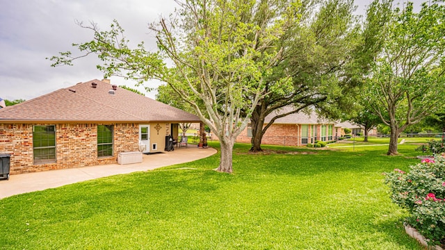 9100 Bellechase, Granbury, TX 76049 - view of green lawn featuring a patio area