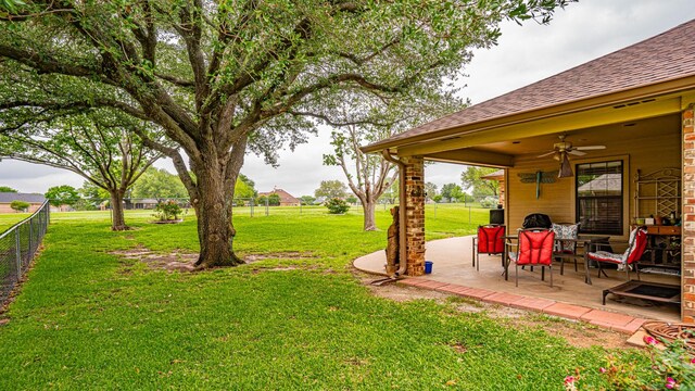 9100 Bellechase, Granbury, TX 76049 - view of yard featuring ceiling fan and a patio