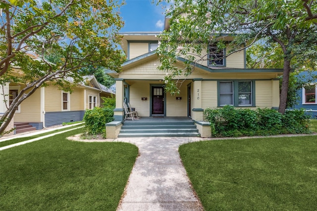 210 S Rosemont Ave, Dallas, TX 75208 - view of front of property with covered porch and a front yard