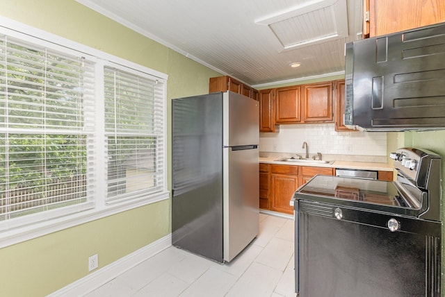 210 S Rosemont Ave, Dallas, TX 75208 - kitchen with appliances with stainless steel finishes, a sink, light countertops, tasteful backsplash, and light tile patterned flooring