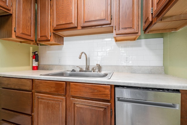 210 S Rosemont Ave, Dallas, TX 75208 - kitchen featuring stainless steel dishwasher, a sink, light countertops, and tasteful backsplash