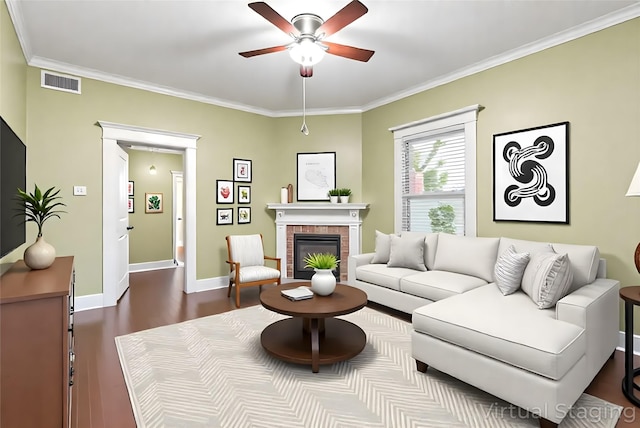 210 S Rosemont Ave, Dallas, TX 75208 - living area with ceiling fan, ornamental molding, dark wood-style flooring, a brick fireplace, and baseboards
