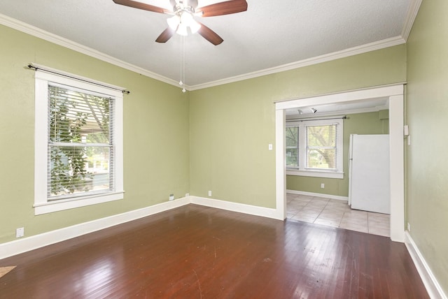 210 S Rosemont Ave, Dallas, TX 75208 - unfurnished room featuring wood finished floors, ornamental molding, a ceiling fan, baseboards, and a textured ceiling