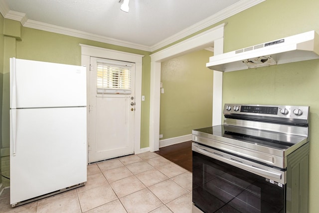 210 S Rosemont Ave, Dallas, TX 75208 - kitchen with freestanding refrigerator, stainless steel range with electric cooktop, under cabinet range hood, crown molding, and light tile patterned floors