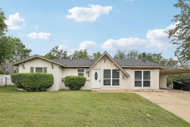 6405 Waynewood Ct, Fort Worth, TX 76135 - view of front of property featuring an attached carport, a front lawn, roof with shingles, concrete driveway, and brick siding