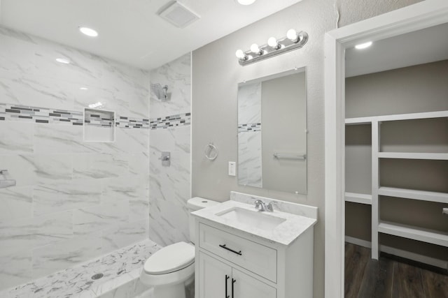 6405 Waynewood Ct, Fort Worth, TX 76135 - bathroom featuring a shower stall, toilet, vanity, wood finished floors, and recessed lighting