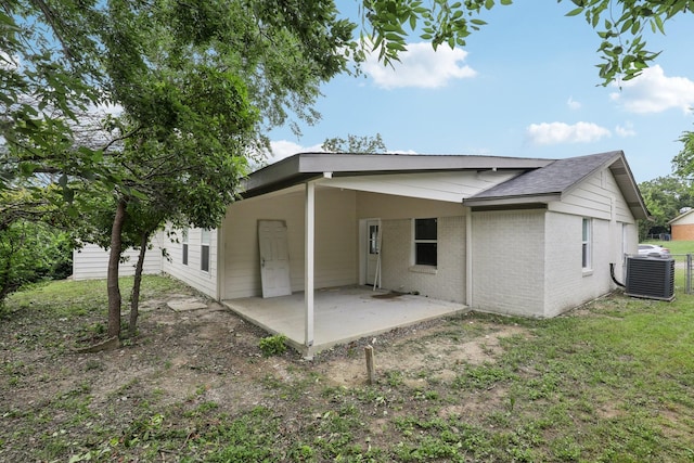 6405 Waynewood Ct, Fort Worth, TX 76135 - rear view of property featuring central AC unit, brick siding, a patio area, and roof with shingles