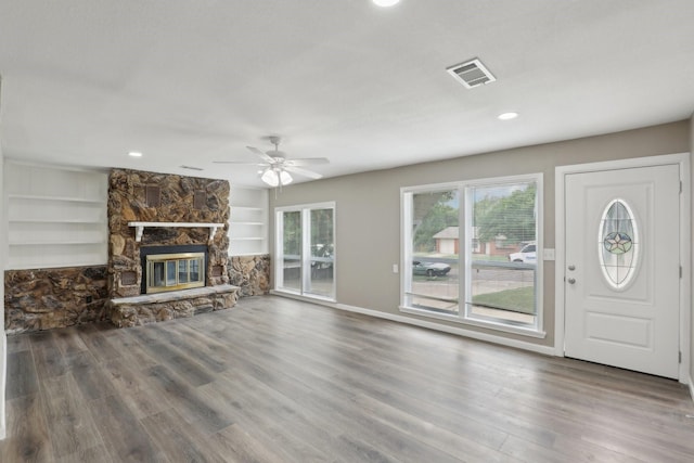 6405 Waynewood Ct, Fort Worth, TX 76135 - unfurnished living room featuring wood finished floors, a ceiling fan, baseboards, a stone fireplace, and recessed lighting
