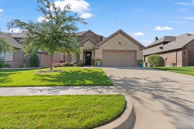 1761 Stillwater Dr, Burleson, TX 76028 - view of front of property with an attached garage, driveway, a front lawn, and stone siding