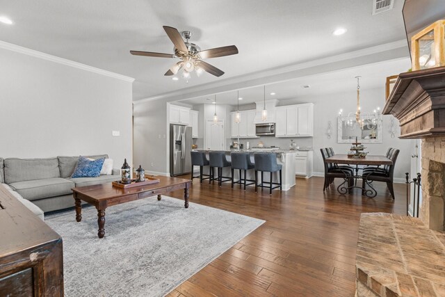 1761 Stillwater Dr, Burleson, TX 76028 - living area with ceiling fan, ornamental molding, dark wood-type flooring, baseboards, and recessed lighting