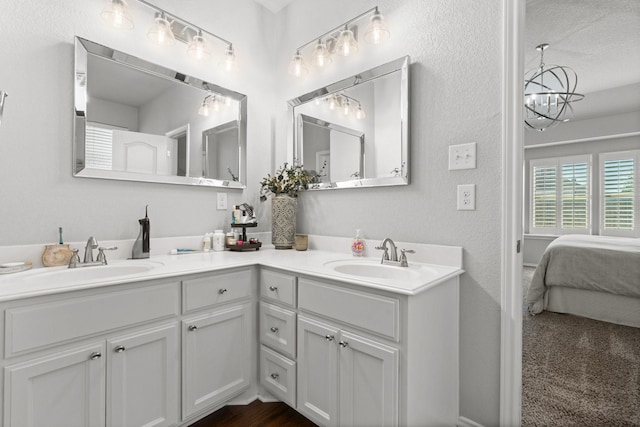 1761 Stillwater Dr, Burleson, TX 76028 - full bathroom featuring connected bathroom, double vanity, and a chandelier
