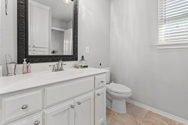 1761 Stillwater Dr, Burleson, TX 76028 - bathroom featuring vanity, toilet, baseboards, and tile patterned floors