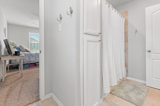 1761 Stillwater Dr, Burleson, TX 76028 - bathroom with a shower with curtain and baseboards
