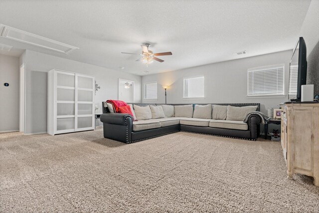 1761 Stillwater Dr, Burleson, TX 76028 - carpeted living room featuring attic access and a ceiling fan