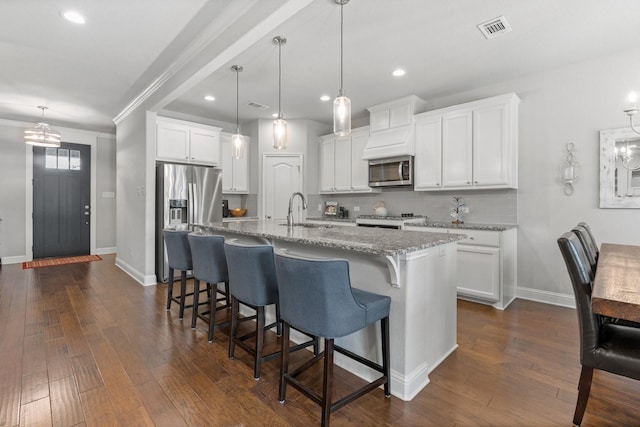 1761 Stillwater Dr, Burleson, TX 76028 - kitchen with stainless steel microwave, a sink, range, tasteful backsplash, and baseboards