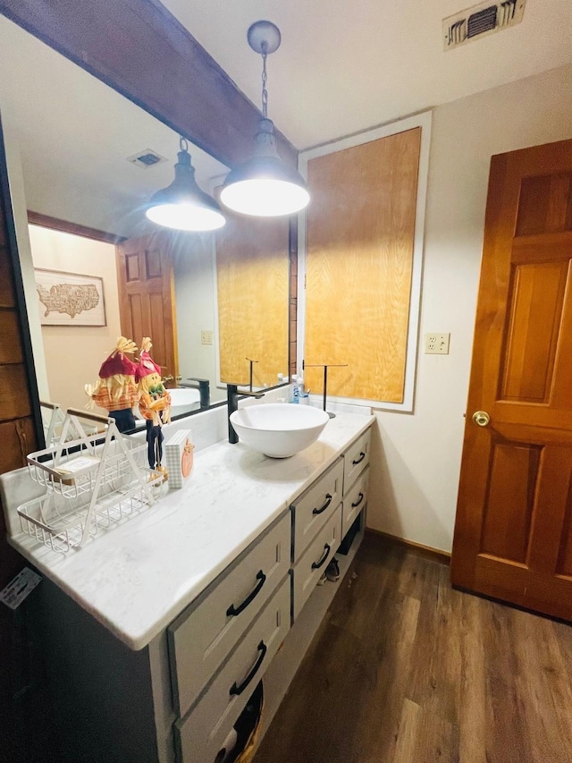 307 S King Lake Rd, Scroggins, TX 75480 - bathroom featuring wood finished floors, vanity, and baseboards