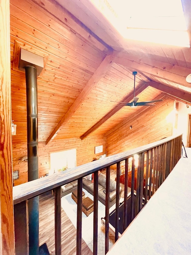 307 S King Lake Rd, Scroggins, TX 75480 - hall with wood walls, wood ceiling, and an upstairs landing