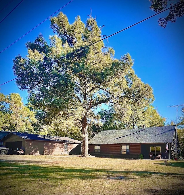 307 S King Lake Rd, Scroggins, TX 75480 - view of side of home featuring a yard