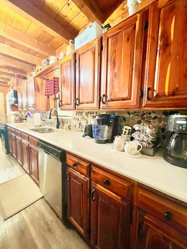 307 S King Lake Rd, Scroggins, TX 75480 - kitchen featuring stainless steel dishwasher, a sink, light countertops, wood ceiling with exposed beams, and light wood-type flooring