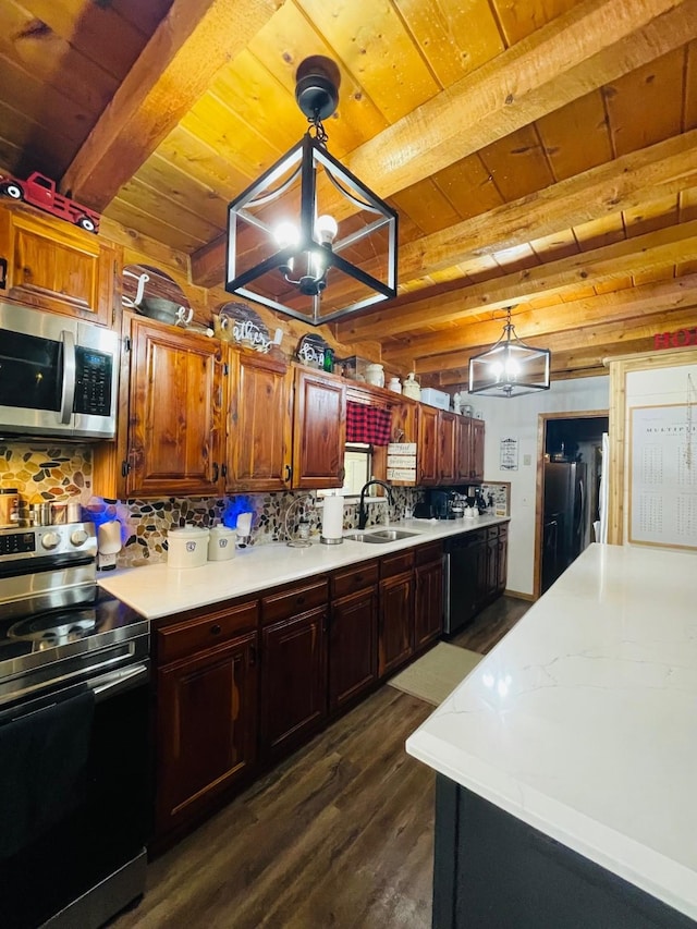 307 S King Lake Rd, Scroggins, TX 75480 - kitchen with appliances with stainless steel finishes, wood ceiling with exposed beams, a sink, dark wood finished floors, and light countertops