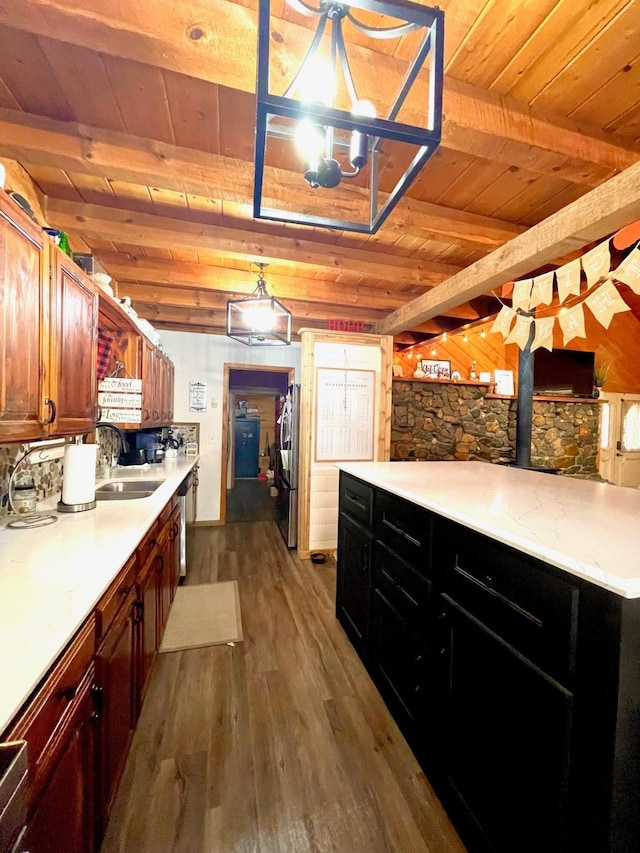 307 S King Lake Rd, Scroggins, TX 75480 - kitchen with a sink, wood ceiling with exposed beams, freestanding refrigerator, dark wood-style flooring, and light countertops