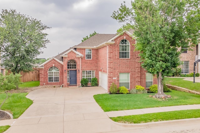 5309 Chatsworth Ln, Fort Worth, TX 76244 - view of front of property with brick siding, driveway, a front lawn, and an attached garage