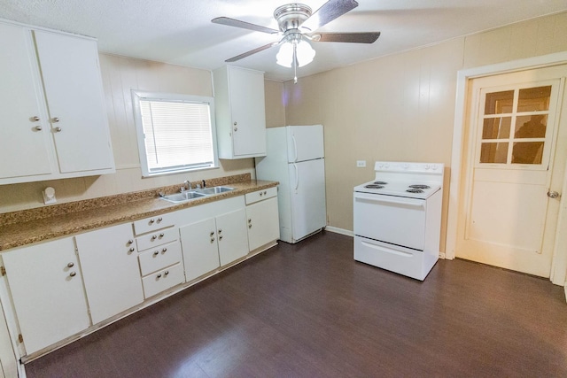 1708 S Jefferson St, Kaufman, TX 75142 - kitchen featuring white appliances, a sink, dark wood-type flooring, a ceiling fan, and white cabinets