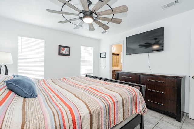 13063 Whiterock Rd, Mabank, TX 75147 - bedroom featuring light tile patterned flooring, ceiling fan, and connected bathroom