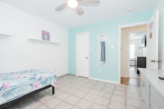 13063 Whiterock Rd, Mabank, TX 75147 - bedroom featuring light tile patterned flooring, a ceiling fan, and baseboards