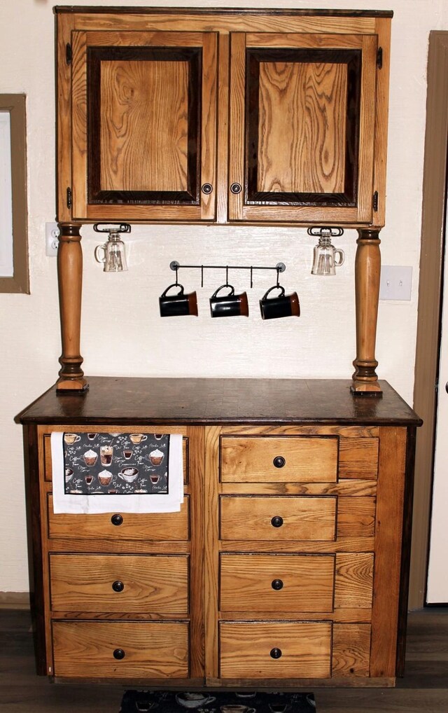 206 W Dewey St, Malakoff, TX 75148 - bar featuring decorative backsplash and wood finished floors