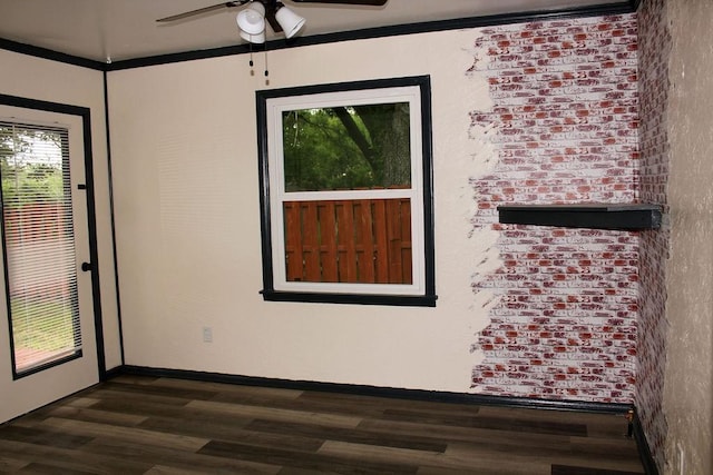206 W Dewey St, Malakoff, TX 75148 - unfurnished room featuring dark wood-type flooring, a ceiling fan, crown molding, and baseboards