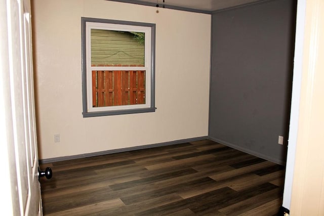 206 W Dewey St, Malakoff, TX 75148 - spare room featuring dark wood-type flooring and baseboards