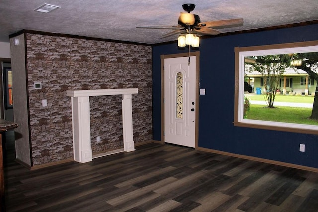 206 W Dewey St, Malakoff, TX 75148 - entrance foyer featuring wood finished floors, a ceiling fan, a textured ceiling, and baseboards