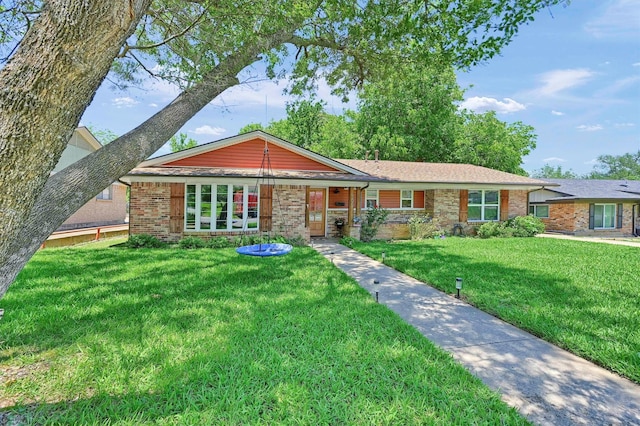 1705 W Belden St, Sherman, TX 75092 - ranch-style home with a front lawn and brick siding