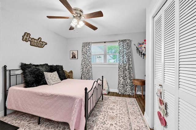 1705 W Belden St, Sherman, TX 75092 - bedroom featuring baseboards, wood finished floors, a closet, and a ceiling fan