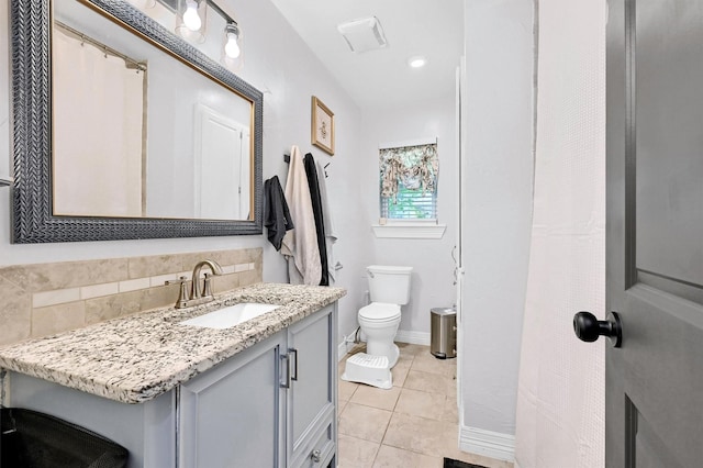 1705 W Belden St, Sherman, TX 75092 - bathroom featuring tile patterned floors, toilet, vanity, and baseboards