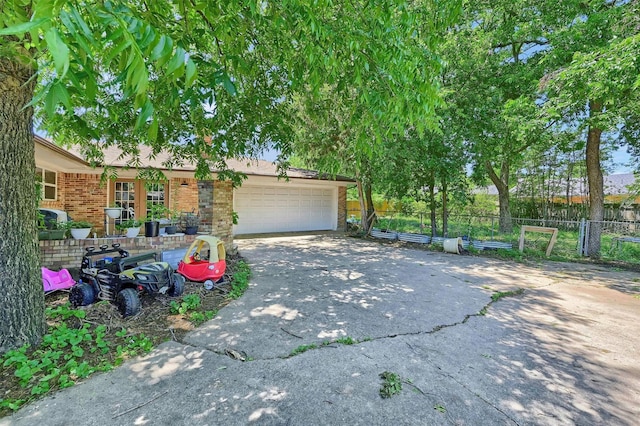 1705 W Belden St, Sherman, TX 75092 - view of front of property with driveway, brick siding, and a garage