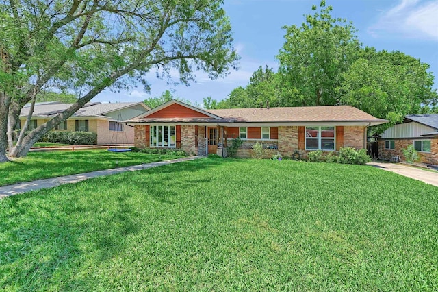 1705 W Belden St, Sherman, TX 75092 - single story home with a front yard and brick siding