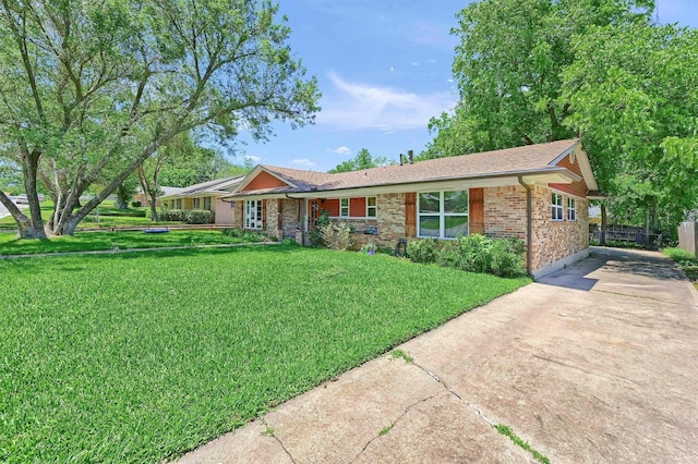 1705 W Belden St, Sherman, TX 75092 - ranch-style home featuring concrete driveway, a front lawn, and brick siding