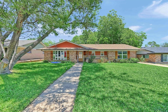 1705 W Belden St, Sherman, TX 75092 - view of front of house featuring a front yard and brick siding