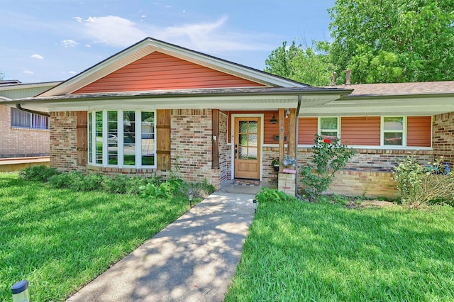 1705 W Belden St, Sherman, TX 75092 - view of front of house with brick siding, a front lawn, and covered porch