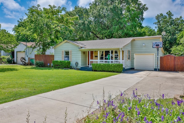 216 E Tennie St, Gainesville, TX 76240 - ranch-style house featuring covered porch, a garage, and driveway