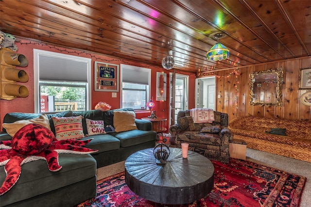 216 E Tennie St, Gainesville, TX 76240 - carpeted living area with wooden ceiling and wood walls