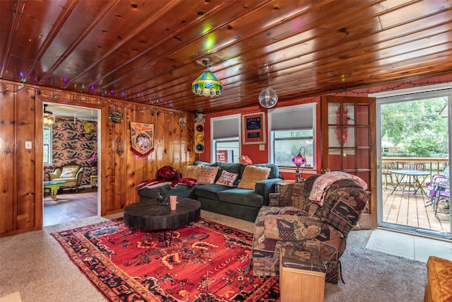 216 E Tennie St, Gainesville, TX 76240 - living room featuring carpet floors, wooden ceiling, and wood walls